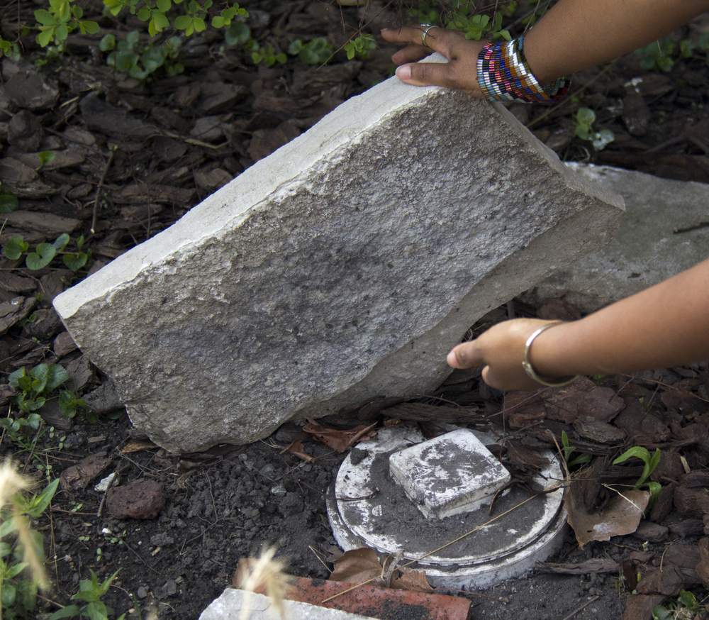 A back-up valve is hidden under a stone in Lori Burns' rain garden.