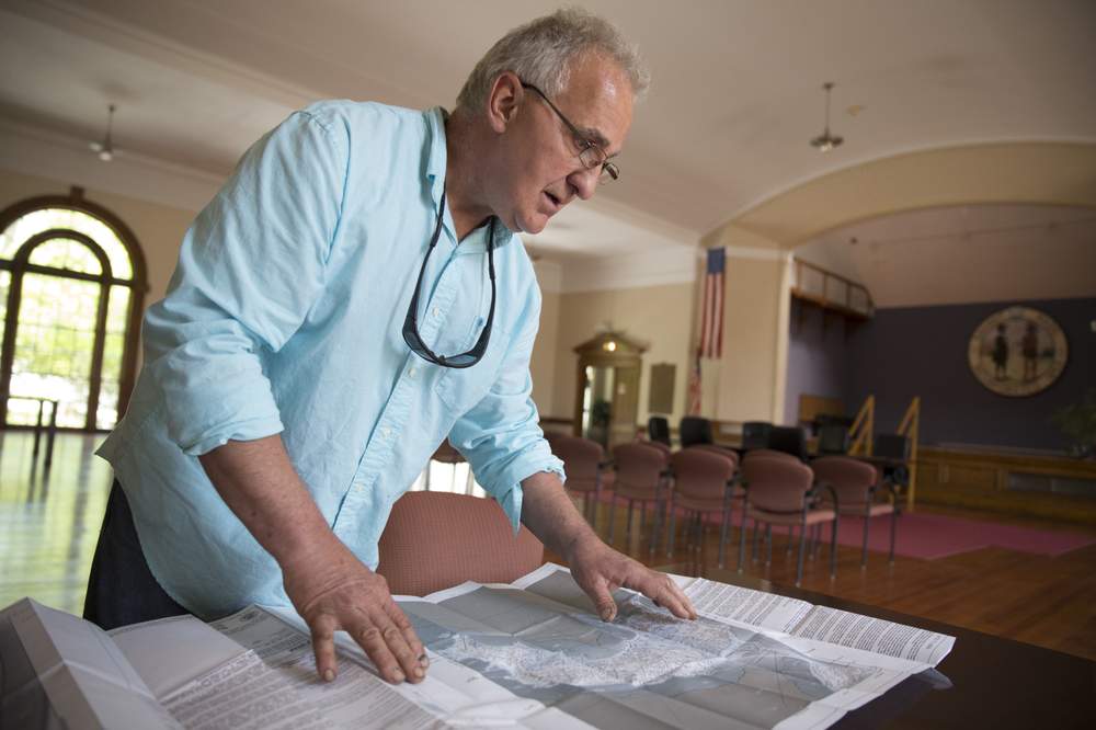 Enzo Barile looks over federal flood-risk maps for Nahant. Enzo Barile looks over federal flood-risk maps for Nahant.